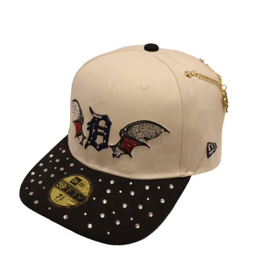 Two decorative hats with unique designs on a light background
