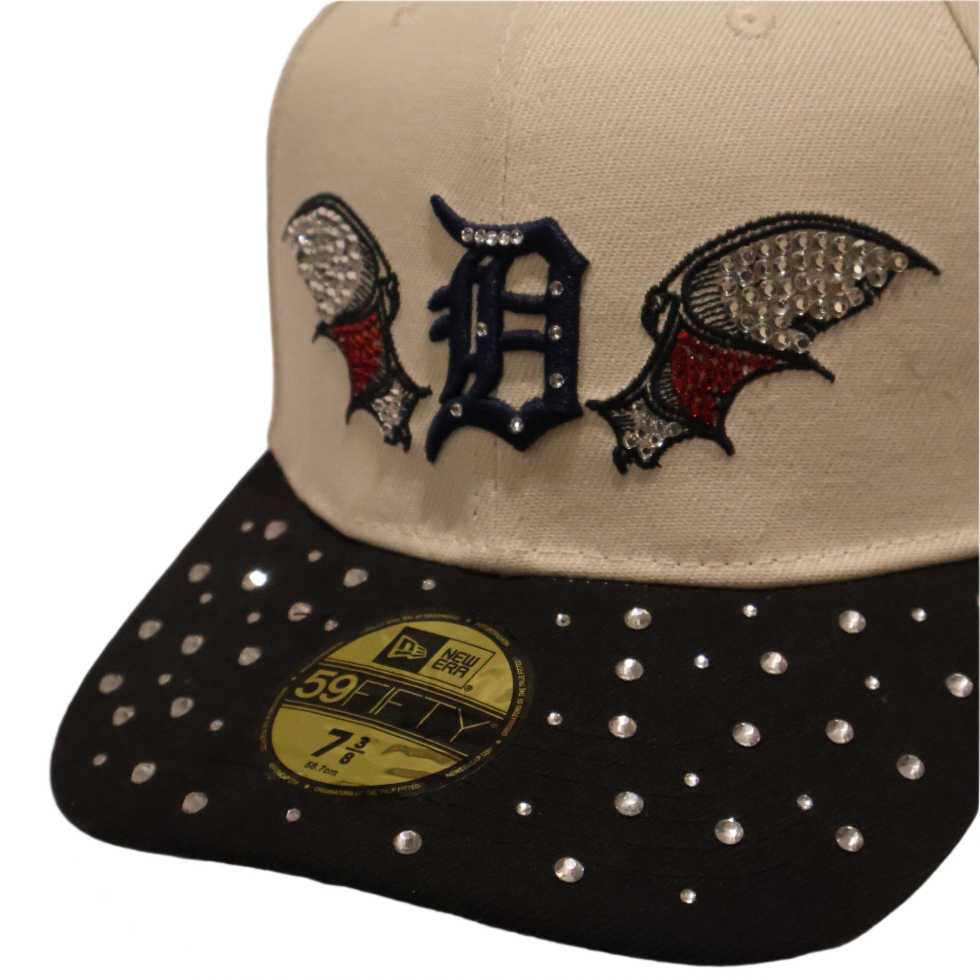 Two baseball caps with decorative elements on a plain background